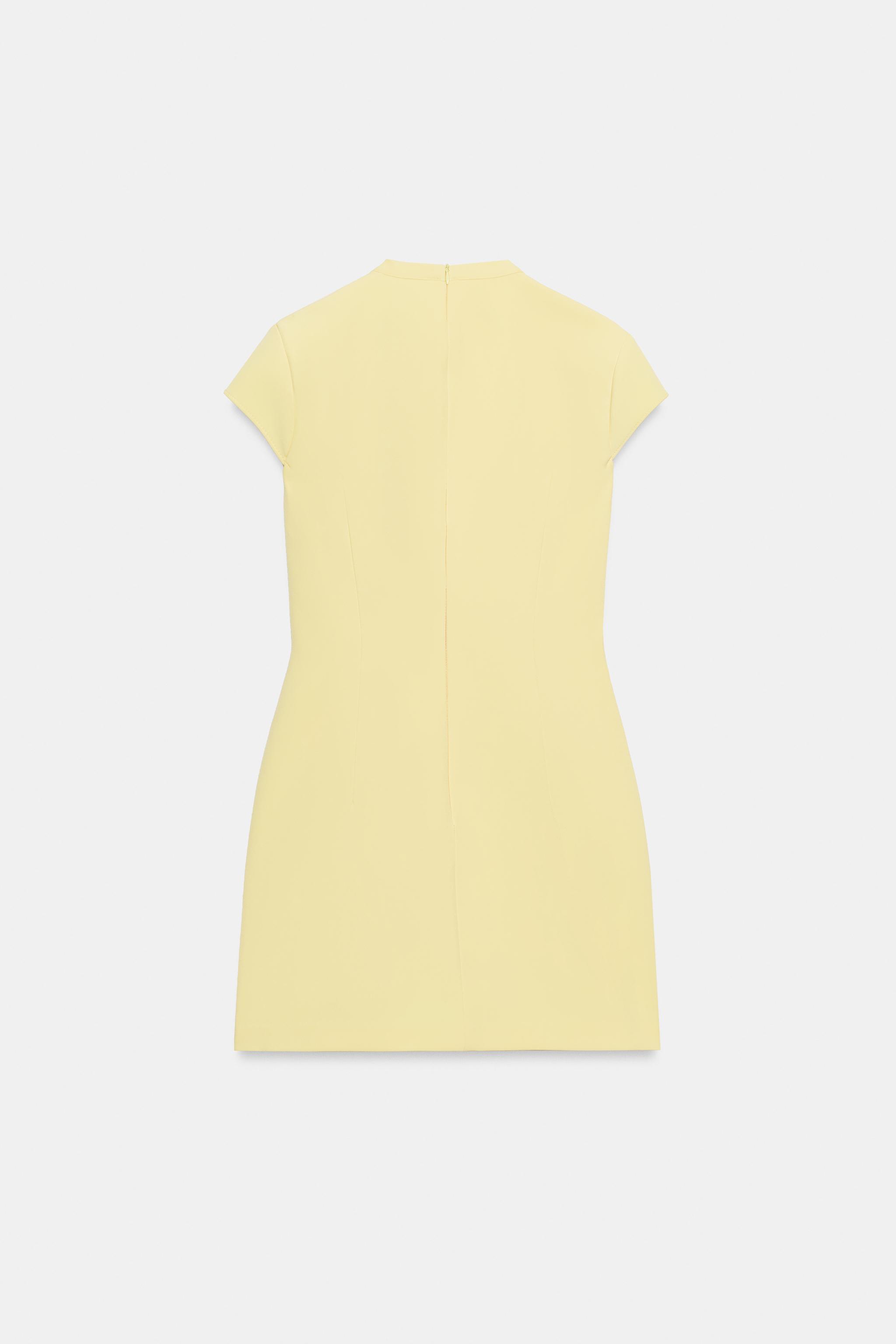ROBE COURTE À NŒUD POIS